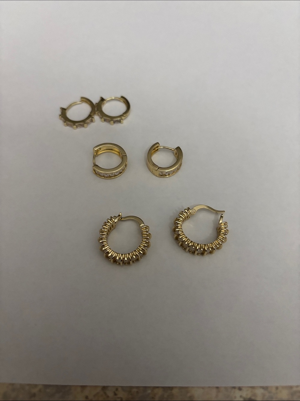 3 pair Gold Hoop Earring Set. Gold hoop earrings with CZ.